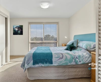 Bright and inviting bedroom featuring natural light, comfortable furnishings, and a peaceful atmosphere.