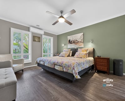 Bright and inviting bedroom featuring modern amenities and a tranquil view, perfect for relaxation.