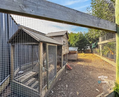 Explore this unique property featuring an expansive outdoor area with poultry housing and ample space for gardening.