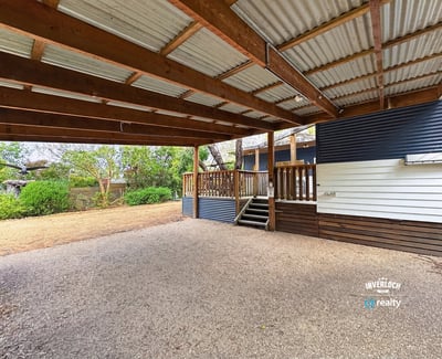 Spacious covered outdoor area perfect for gatherings and enjoying the surrounding natural landscape.