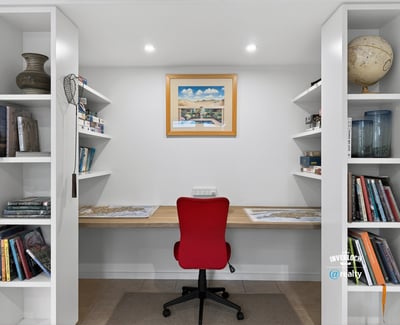 Bright and functional office space with built-in shelving, perfect for productivity and organization.