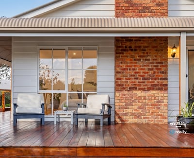 Relax on the spacious deck, featuring inviting seating and a blend of modern and classic design.