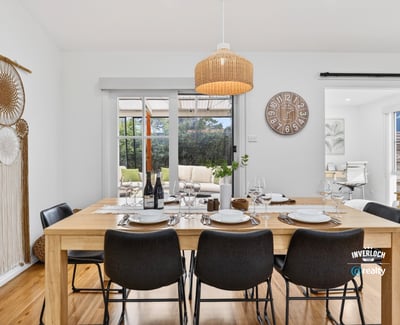 Bright dining area featuring natural wood accents, perfect for gatherings and everyday meals with family.