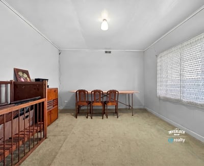 Spacious room with abundant natural light, ideal for an office or creative workspace.