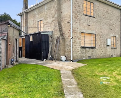This spacious property features ample outdoor space and a versatile layout for various living options.