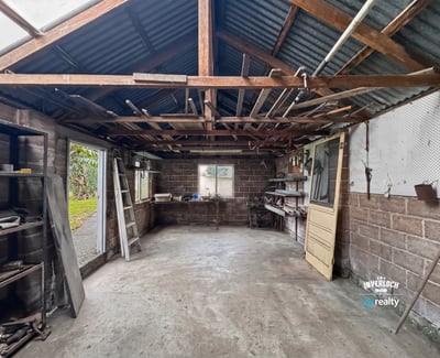 Spacious workshop with open layout, ample natural light, and potential for customization to suit your needs.