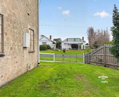 This property offers a spacious side yard with easy access to the street and neighboring homes.