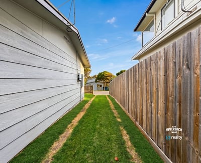 This property features a spacious side yard, perfect for outdoor activities or potential landscaping opportunities.