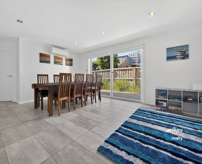 Spacious dining area with natural light, offering a seamless connection to the outdoor space.