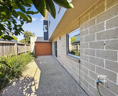 Contemporary home featuring a unique façade, private driveway, and landscaped outdoor space. Perfect for modern living.
