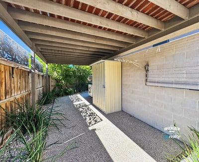 Discover a private outdoor space featuring ample shade, perfect for relaxation or entertaining.