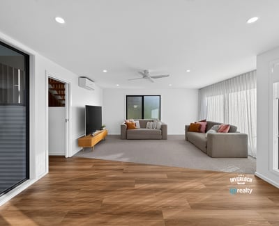 Spacious living area featuring modern finishes and ample natural light, perfect for relaxed entertaining.
