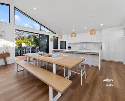 Bright and spacious kitchen features modern amenities, abundant natural light, and an inviting dining area.