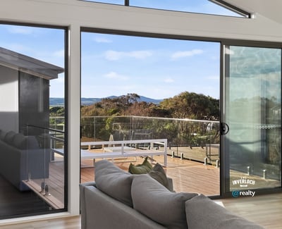 Spacious living area with expansive views, featuring large windows that invite abundant natural light.