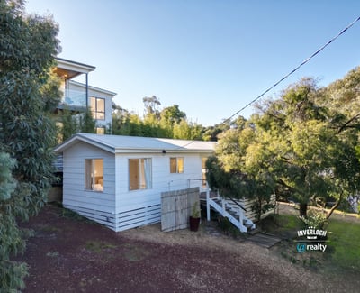 Cozy retreat nestled among lush greenery, offering a peaceful atmosphere and comfortable living space.