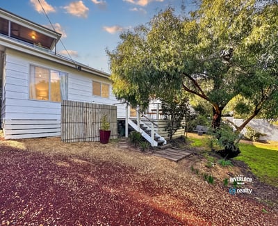 Cozy home with a spacious yard, perfect for outdoor activities and family gatherings.