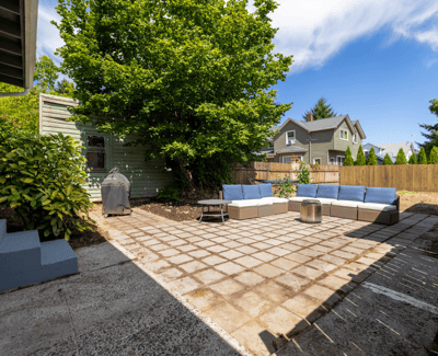 Spacious outdoor patio area with comfortable seating, perfect for entertaining or relaxing in the sun.