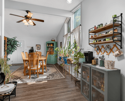 Bright and airy dining area featuring ample natural light and a cozy atmosphere for gatherings.