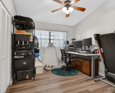 This versatile room offers ample storage, ideal for a home office or creative space.