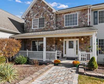 Stone accents, professional landscaping, classic front porch. Enjoy amazing sunset views!