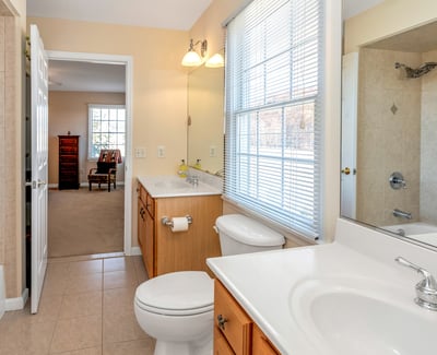 A Jack and Jill Bathroom is shared by bedrooms 3 and 4. Double sinks, tiled shower/tub.