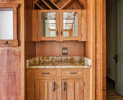 Built in wine bar with ample storage, stone countertop, and custom cabinetry. A standout entertaining feature that adds both style and function to this Phoenix home.