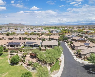 Elevated aerial perspective highlighting solar energy features, nearby park space, and a well-maintained Phoenix neighborhood. A smart blend of efficiency and outdoor surroundings.