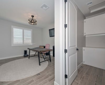 Functional meets stylish with upper/lower cabinets in the laundry area and adjacent bonus space for an office or hobby zone.