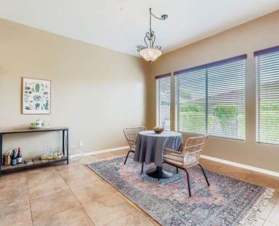 A light-filled breakfast nook offers views of the landscaped backyard, creating the perfect spot for everyday dining.