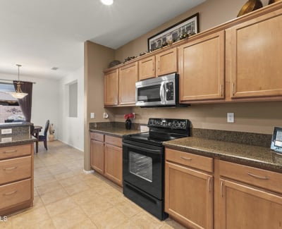 A beautiful combination of form and function, this kitchen offers plenty of prep areas and direct access to the dining and great rooms.