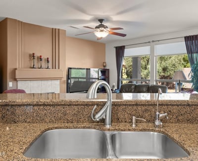 Entertain in style from this kitchen s granite island and dual sinks. The open concept keeps everyone connected and enhances flow throughout the home.