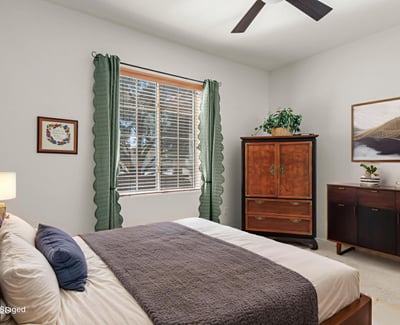 The guest room offers soft light, warm tones, and a peaceful feel ideal for guests or multi-purpose use.