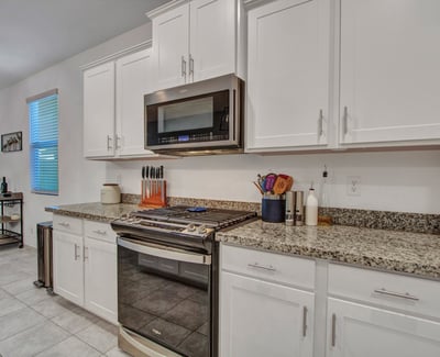 Featuring granite counters, stainless range, and abundant cabinetry, this updated kitchen blends efficiency and modern design perfect for today s Litchfield Park buyer.