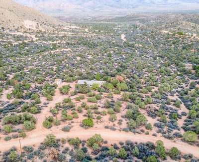 From above, the layered hills and desert shrubs frame the property beautifully, highlighting its peaceful placement within Hackberry s natural landscape. A true retreat for nature lovers