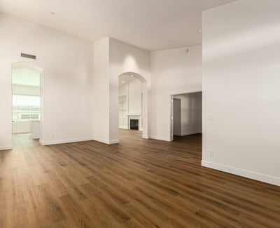 Dramatic vaulted ceilings and clean modern finishes highlight this spacious Scottsdale living area. The open design and large windows create a bright environment ideal for relaxing or entertaining.