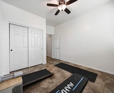 Bedroom closet featuring built-in shelving and hanging rods, maximizing storage and organization.