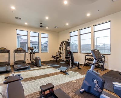 Resident fitness facility equipped with cardio and strength training machines, supporting an active lifestyle close to home.