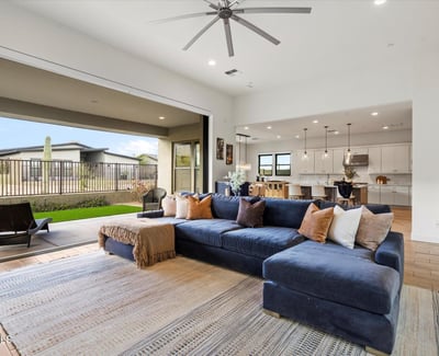Open living area filled with natural light, high ceilings, and modern design elements. Perfect for Scottsdale buyers seeking spacious and stylish interiors.