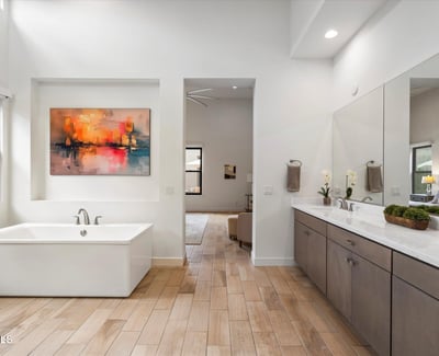 Modern primary bath highlighting a freestanding tub and serene design. This Scottsdale luxury bathroom delivers spa-style comfort and timeless elegance.