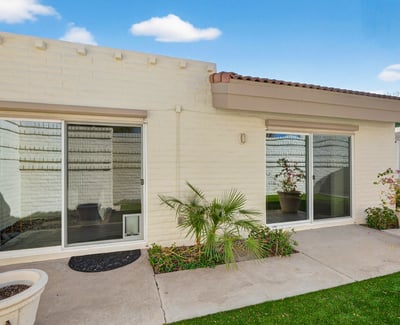 Private patio courtyard offering indoor-outdoor living, low-maintenance landscaping, and a peaceful setting.