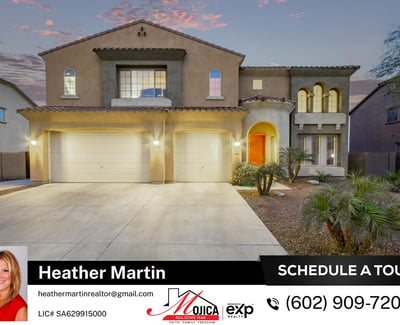 Exterior lighting highlights the architectural charm of this Glendale home at twilight. The three-car garage, extended driveway, and clean desert landscaping create a stunning first impression.