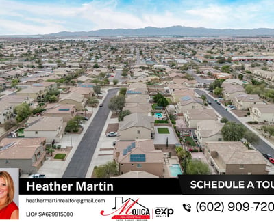 This elevated aerial image highlights the rooftop solar system and fenced backyard pool. Surrounded by desert landscaping, this Glendale home combines energy-efficient upgrades with outdoor entertaining space.