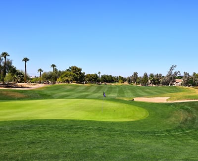 Golf course featuring pristine greens, sand bunkers, and open fairways. This Phoenix community offers a scenic and active outdoor lifestyle.