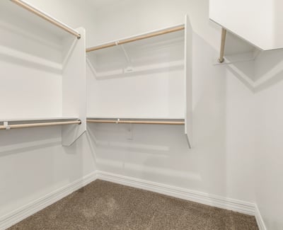 Large walk-in closet with built-in organization, ideal for maximizing storage and keeping everything neatly arranged.