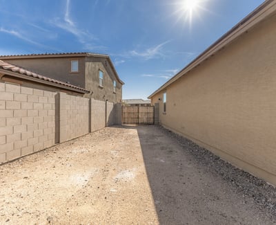 Convenient side yard access with RV gate, providing space for parking, storage, or recreational vehicle use.