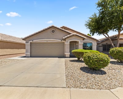 Elevated view of this well-kept property highlighting its clean exterior, garage, and peaceful residential setting in Surprise.