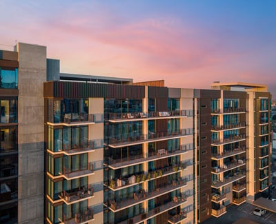 Contemporary building exterior with multiple private balconies and updated design elements, highlighting upscale living in Phoenix.