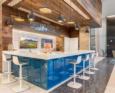 Spacious lounge with integrated bar and modern seating, designed for entertaining and relaxation in Phoenix