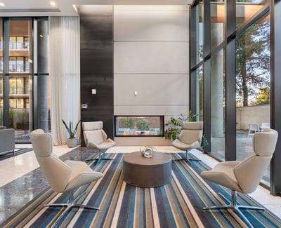 Inviting lounge area with a modern fireplace, plush seating, and elegant finishes, perfect for relaxing in Phoenix.