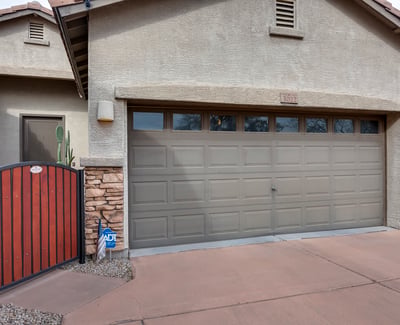 Split garage layout with gated side access and extended slab, perfect for additional parking, tools, or recreational storage in this Phoenix home.